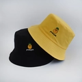 Close-up of yellow and black bucket hats featuring detailed pineapple fruit embroidery - Adult 55-58cm / Pineapple Yellow