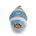 Macro detail of blue and white enamel egg pendant with gold plating and cubic zirconia - Blue and White Striped Egg Pendant