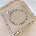 Detalle de pulsera de corazón en acero inoxidable plateado con etiqueta S.STEEL - Color Acero (J117)