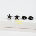 Detail showing 0.7cm black star stud earrings with weight specs on stone base - 007 Black Star