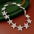 Detailed macro view of silver star necklace with sparkling crystals on dark velvet - Star Splicing Style (Silver)
