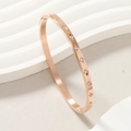 Rose gold stainless steel bangle with ten star-set white zircons for women - Rose Gold