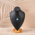 Elegant silver necklace with blue heart crystal pendant displayed on a black mannequin - Large / Black PU Leather