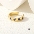 Detailed macro view of the gold-plated open ring with vibrant blue star patterns - Blue Stars (RG0441-G)