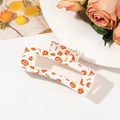 Halloween claw clip with orange pumpkin and skull prints on creamy white base - Cream White Halloween Pumpkin