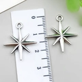 Silver hollow star cross charms for jewelry making shown with measurement ruler - Eight-Pointed Star Style (21508) / 1 Piece/Pack (23x20mm) / Antique Silver