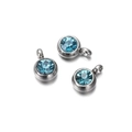 Close-up of three round silver charms with brilliant blue zircon insets for DIY jewelry - 10 Pieces per Pack / Steel Border Lake Blue Stone