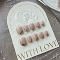 Close-up of handmade nude press-on nails with elegant gold glitter and sequins detail. - L / French Sparkle (526)