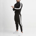 Detailed side view of men's slim fit black tracksuit with white side stripes and stand collar - Black & White