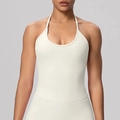 Front view of a cream-colored halter neck yoga sports bra with thin straps and a U-neckline - S / Light Ivory