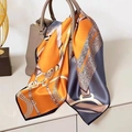 Orange and grey equestrian print silk scarf draped elegantly over a luxury handbag - Lock Chain Scarf / 65