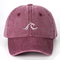 Detailed view of the embroidered wave pattern on a vintage washed burgundy baseball cap - Adjustable / Burgundy