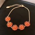 Bracelet élégant plaqué or 18 carats avec fleurs en zircon orange et fermoir mousqueton - Or-Orange