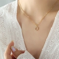 Golden titanium steel necklace with letter O pendant featuring small inlaid zircon stones - Letter O / Gold