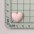 Detailed macro shot of a pink macaron heart resin accessory measuring 2cm in width - Dusky Pink