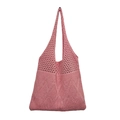 Detail view of pink knitted tote bag showing hollow diamond pattern and solid knit texture - Pink
