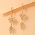 Detailed view of champagne gold floral earrings with white cubic zirconia accents - EH094 Rotating Windmill Leaf Style