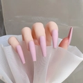 Close-up of matte pink long ballerina fake nails on model hand with white mesh - Matte Pink-Glossy(CBL-36)