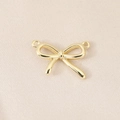 Detailed macro view of 18K gold plated bowknot pendant with double connecting loops - Slender Double Loop Bow (PJ0474) / Gold