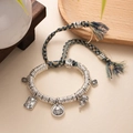 Close-up of woven bracelet with silver pendants, gourds and peace tag detail - L393-1 Yellow Wealth God (Yellow-Green Rope)
