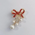 Golden bow brooch with sparkling red rhinestones and elegant white hanging pearls - Red Bow Pearl