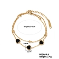 Detail view of double-layer gold heart bracelet with dimensions 17 plus 5cm and 3.4g weight - Gold (B00664-1)