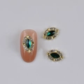 Golden nail jewelry set with marquise green gemstone and clear rhinestones - Gold Base Green Marquise Gemstone