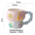 Hand-painted ceramic breakfast mug with blue beads handle and 420ml capacity - Beaded Blueberry