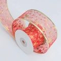 Detail of red sheer organza ribbon with gold foil stars and snowflakes on a roll - 5cm Wide / Red Bronzing