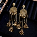 Close-up of bohemian vintage gold tassel earrings displayed on blue velvet jewelry box - Gold (S925 Silver Pin)