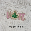 Pink enamel VOTE brooch with AKA Greek letters and pearl leaf accent on white fabric - Gold/Pink AKA