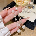 Elegant long tassel earrings with pearls and crystals in a golden finish for women - Pearl Double Tassel (E0054)