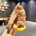 Cute Capybara keychain featuring a 3D figure with yellow duck swim ring and brown strap - B199-2 Swim Ring