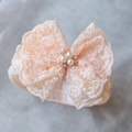 Pink baby lace headband with large bow featuring faux pearls and sparkling rhinestones - Orange Pink Lace With Rhinestones
