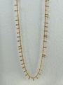 Detail of vintage 18k gold plated waist chain featuring textured cylindrical pendants - Tassel Style / Gold