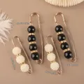 Elegant gold alloy brooch set with black and white pearls and rhinestones in two sizes - Pearl Style (A20-1)