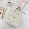 Close-up of quilted canvas tote bag with colorful butterfly embroidery and branded woven label - Multicolor Rabbit