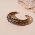 Detailed macro view of retro brown marbled acrylic cuff bracelet with spiral texture design - Gray Twill Open Style (65#)