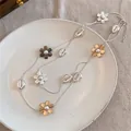 Détail d'un collier vintage à double rang avec fleurs, perles et breloques de coquillage - 6# Collier-Mélange Or-Argent