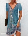 Close-up of V-neckline with vintage bohemian floral print on turquoise blue dress - S / Bottoms / T-Shirts / Blue