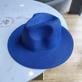 Detail of royal blue straw sun hat with fine weaving texture and classic pinched crown design - Royal Blue