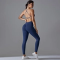 Detail of high-waist yoga leggings and strappy sports bra with ruched butt-lifting effect - S / Dark Blue