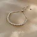 Minimalist adjustable silver tennis bracelet with cubic zirconia on champagne satin - Cross Slider Bracelet-Silver