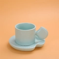 Light blue ceramic coffee cup and saucer set with unique shell-shaped handle and base - Shell Shape Cup + Saucer - Mint Green