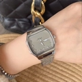 Silver square metal watch with taupe dial and calendar display on woman's wrist - Silver Case Grey Dial
