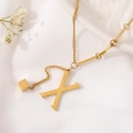 Detail of gold letter M pendant necklace with metallic fringe over white fabric - Gold Initial X (8847)