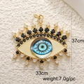 Detailed view of evil eye jewelry pendant with gold finish and zircon stones - A0246