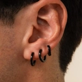 Three-piece set of minimalist black geometric C-shaped earrings for women shown on ear - Black Minimalist Hoop Clips (6181001HB)