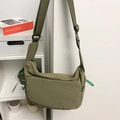 Olive green nylon messenger bag with adjustable strap and contrast zipper puller - Green