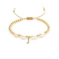 Detail of baroque pearl bracelet with golden beads and a J letter pendant - Letter J
